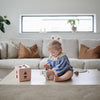 Jouet spinner à ventouse Mushie pour bébé bleu et beige