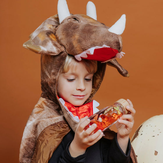 Bouteille sensorielle Petit Boum Move T-Rex avec liquide rouge et dinosaure flottant