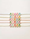 Bracelet enfant perles lettres BISOU fluo multicolore – Mini Galaxie