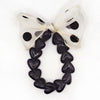Bracelet GAGA à perles noires et maxi nœud beige à pois