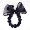 Bracelet GAGA à perles noires et maxi nœud noir à pois