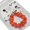 Bracelet GAGA à perles rouges et maxi nœud beige à pois