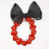 Bracelet GAGA à perles rouges et maxi nœud noir à pois