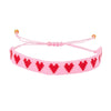 Bracelet perlé cœur rouge Atelier Wagram sur carte cadeau – idée cadeau amour