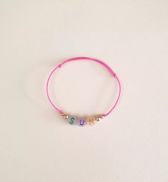 Bracelet enfant lettres SUN perles fluo et cœur doré – Mini Galaxie