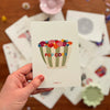 Carte Pop Corn fleurie Papier Poetic avec illustration colorée et fleurs poétiques