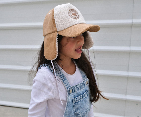 Casquette avec cache oreilles velours et sherpa pour enfant Poule Party.