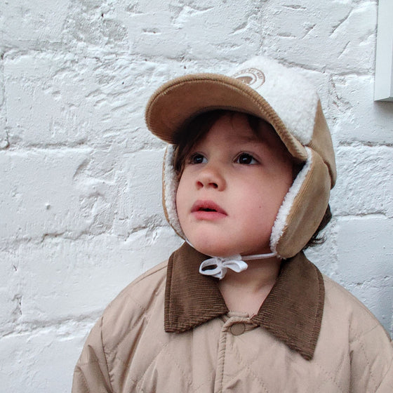 Casquette avec cache oreilles velours et sherpa pour enfant Poule Party.