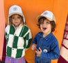 Casquette avec cache oreilles velours et sherpa pour enfant Poule Party.