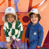 Casquette avec cache oreilles velours et sherpa pour enfant Poule Party.
