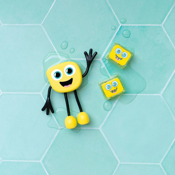 Personnage Alex jaune et cubes lumineux pour le bain Glo Pals.