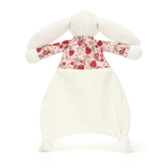 Doudou lapin Jellycat Blossom Cream Berry avec oreilles et haut fleuris, fond blanc