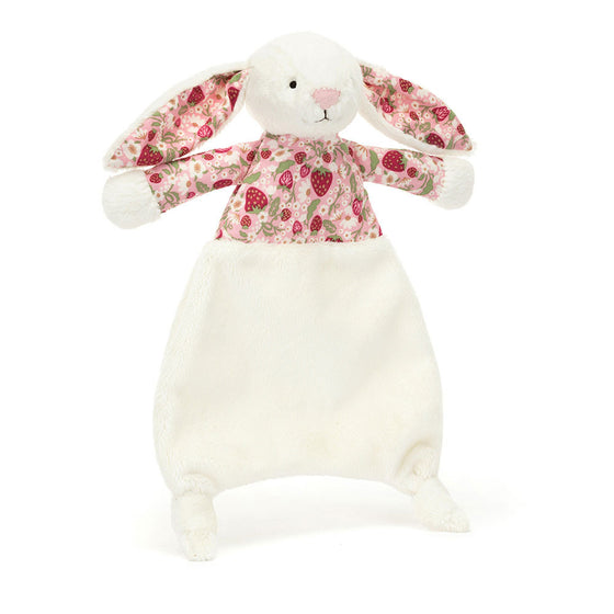 Doudou lapin Jellycat Blossom Cream Berry avec oreilles et haut fleuris, fond blanc