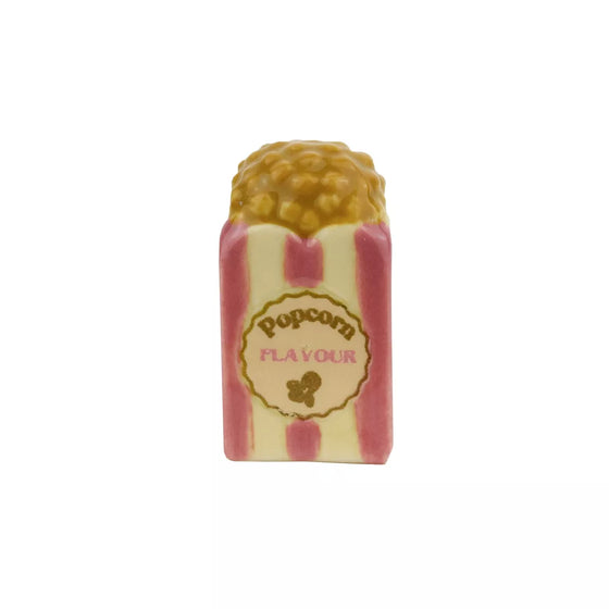 Fève Pop Corn Baubels en porcelaine artisanale rose et dorée sur carte Les Jolies Fèves