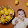 Hochet en bois sensoriel Donut Lemons Petit Boum avec perles jaunes et citrons