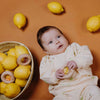 Hochet en bois sensoriel Donut Lemons Petit Boum avec perles jaunes et citrons