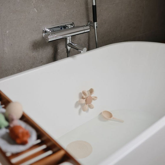 Jouet de bain Mushie silicone roue à eau beige confettis avec louche