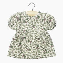  Robe "Faustine" en coton double gaze pour poupée Babies de Minikane, imprimé floral délicat sur fond écru. Modèle à manches courtes bouffantes et coupe évasée, conçu pour habiller un poupon avec élégance. Accessoire idéal pour enrichir la garde-robe des poupées.