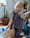 Nid Bag Teddy 2-en-1 Tante Reine Housse coussin d'allaitement et sac de rangement.