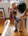 Nid Bag Teddy 2-en-1 Tante Reine Housse coussin d'allaitement et sac de rangement.