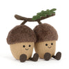 Peluche glands mignons avec visages souriants et feuille sur la tête