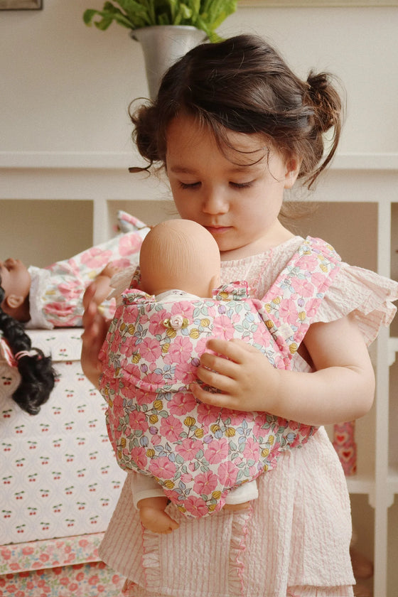 Porte-bébé enfant pour poupée motif floral rose Konges Sløjd