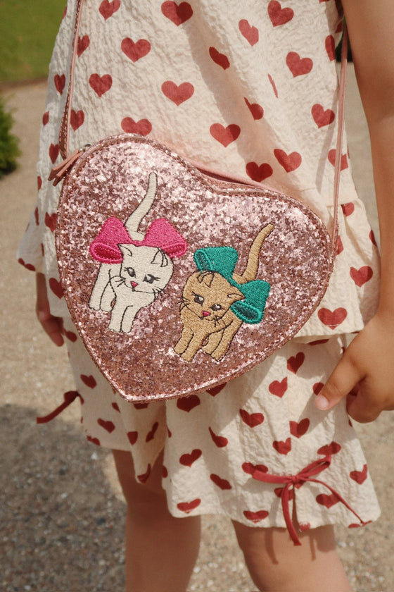 Sac à bandoulière enfant rose pailleté avec motif chats en forme de cœur Konges Sløjd