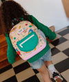 Sac à dos Cocktail Party Hello Hossy beige avec motifs fun pour enfants de 2 à 5 ans