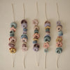 Set de grosses perles à lacer Mushie jeu de motricité fine enfant