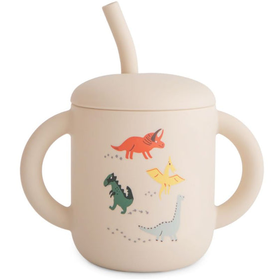 Tasse à paille Mushie Dino en silicone avec poignées et motifs dinosaures